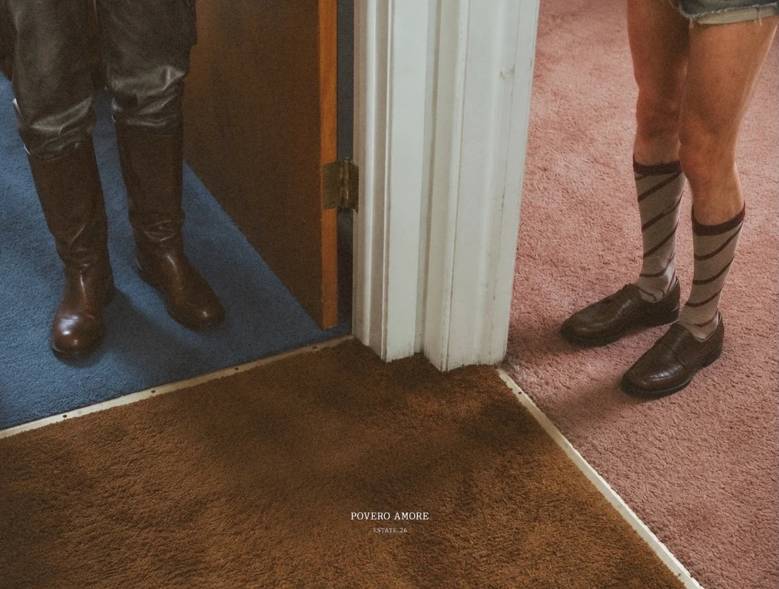 Two figures separated by a doorway